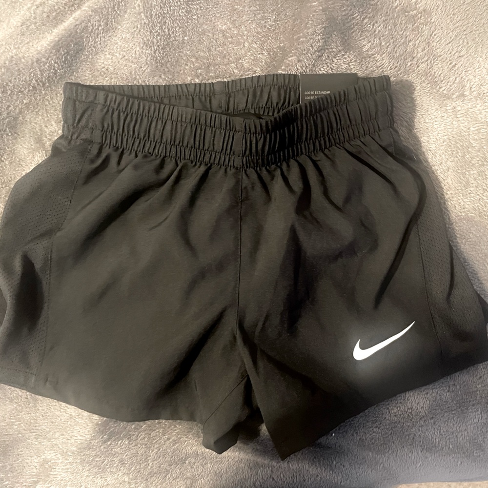 Girl’s black running shorts.